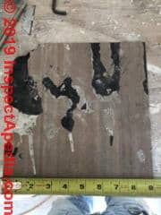 Asbestos-suspect vinyl flooring (C) InspectApedia.com David