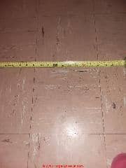 Asbestos-suspect vinyl flooring (C) InspectApedia.com 