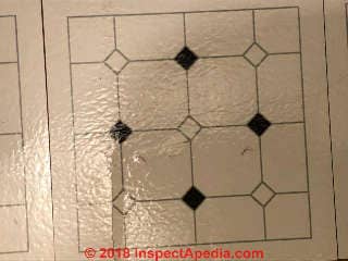Vinyl floor tiles may contain asbestos (C) InspectApedia.com Anna