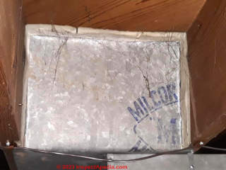 asbestos paper tape wrapped around joints in metal ductwork (C) InspectApedia.com NikkiSmirl