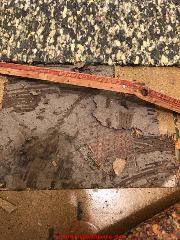 Asbestos may be in the backing of sheet flooring (C) Inspectapedia.com Crystal