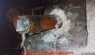 Asbestos flue vent sealant in an older home (C) InspectApedia.com PH