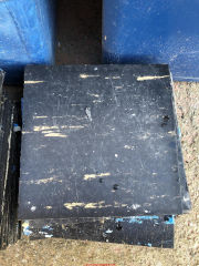 Black floor tiles in the UK 1960s asphalt asbestos  (C) InspectApedia.com Clifford S