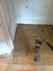 Asbestos suspect flooring in a 1928 home (C) InspectApedia.com Jon