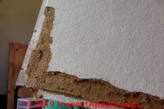 Brown fibrous ceiling tile probabl not asbestos (C) InspectApedia.com
