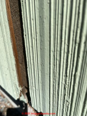 Brushed cedar siding shingles (wood) over fiberboard insulating sheathing (C) InspectApedia.com Rafael