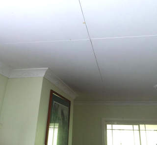discolored ceiling panels (C) InspectApedia.com Trevor
