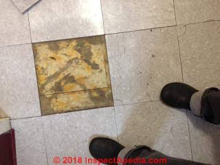 Multiple layers of asbestos suspect floor tiles (C) Inspectapedia.com Katie