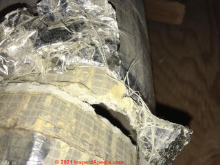 Asbestos ducts wrapped in metal reinforced jute tape at InspectApedia.com Sam