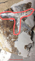 gray backed flooring over concrete fracture repairs (C) InspectApedia.com Eric