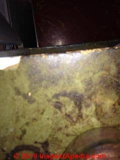 Kitchen cabinet liner, probably not asbestos (C) InspectApedia.com