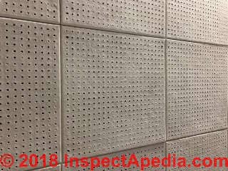 Perforated acoustic ceiling tiles may contain asbestos (C) InspectApedia.com Matt