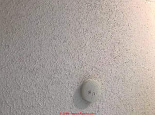 Popcorn spray ceiling may contain asbestos (C) InspectApedias.com
