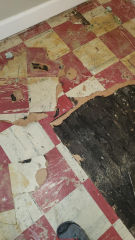 Red and white asbestos suspect floor tiles  (C) InspectApedia.com