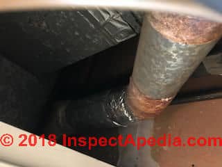 Rust stained duct wrap may be an asbestos paper (C) InspectApedia.com Bobby S