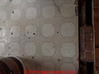 Sticky floor tile may contain asbestos (C) InspectApedia.com Jennifer