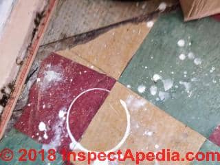 Red, beige, green solid color floor tiles, possibly vinyl orasphalt asbestos (C) InspectApedia.com anon