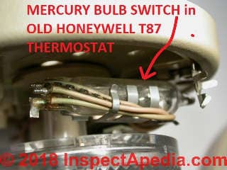 Mercury bulb switch in an old Honeywell T87 thermostat (C) Daniel Friedman at Inspectapedia.com