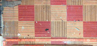 UK PACM sheet flooring in red and tan (C) InspectApedia.com RichP