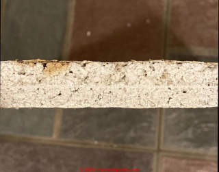 Edge view of US Gypsum ceiling tile - asbestos? (C) InspectApedia.com  Mike