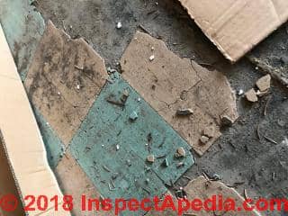 Asbestos floor tiles in very poor condition (C) InspectApedia.com Glenda
