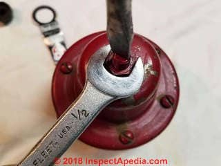 Loosen the lock nut on the pressure reducing valve adjustment screw (C) Daniel Friedman at InspectApedia.com
