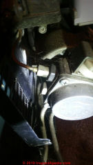 Looking for the air bleeder fitting on an unusual oil burner pump on a Beckett burner (C) InspectApedia.com Colin