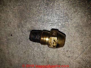 Clogged oil burner nozzle (C) InspectApedia.com Mike
