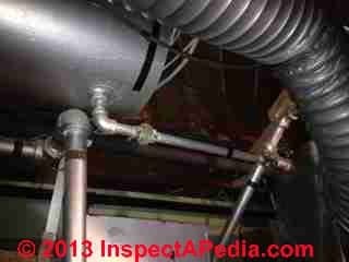 Bladderless expansion tank on gas fired heating  boiler (C) InspectApedia.com HH