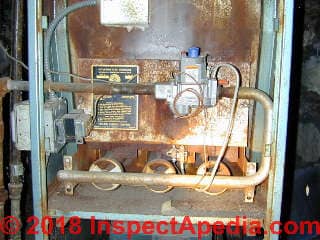 Rusty furnace leaky heat exchanger is dangerous possibly fatal carbon monoxide poisoning (C) InspectApedia.com