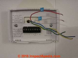 Thermostat wires labelled and straightened out to permit removing the old thermostat base (C) Daniel Friedman