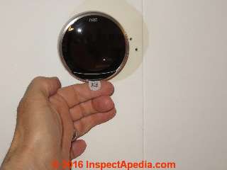 Remove this tab from your Nest Thermostat after it's mounted on the wall (C) Daniel Friedman Nest 3 Thermostat Installation Instructions at InspectApedia.com