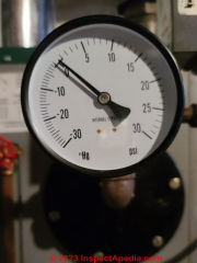 Residential low pressure steam boiler gauge showing low pressure (C) Daniel Friedman at InspectApedia.com