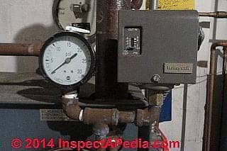 Steam pressure gauge and pressure control switch on a WeilMcLain Model 68 steam boiler (C) Daniel Friedman
