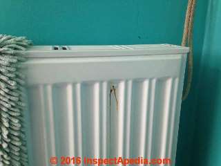 Leak in steel heating radiator (C) InspectApedia MC