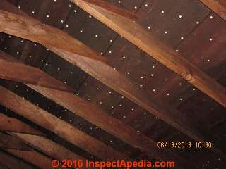 Roof sheathing using perforated boards sporting ceramic bushings (C) InspectApedia.com David Grudzinski