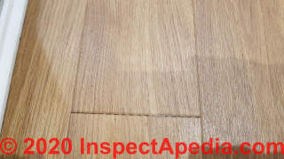 Gaps and ridges in Amitco Spacia flooring (C) InspectApedia.com Chris