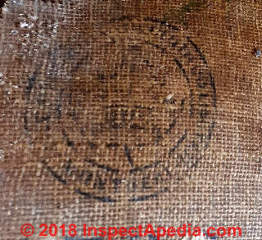 Dominion stamp on antique jute backed linoleum in Ontario (C) InspectApedia.com JD