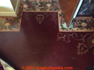 Painted-over asphalt paper backed floor tiles (C) InspectApedia.com  IG