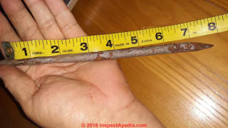 Round nail found in the Bayou (C) InspectApedia.com Cat
