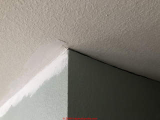 Ceiling wall separation due to rising roof trusses (C) InspectApdia.com Mike