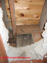 Falling down cellulose insulation at a ceiling cut