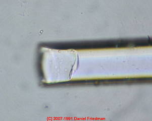 photo of concoidal end fracture on fiberglass fragment