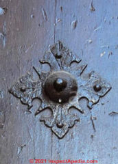 Antique bulb headed nails in an old door at InspectApedia