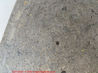 Gray composite flooring - backer? (C) Inspectapedia.com Kayleigh