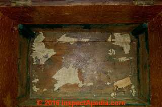 Fragments of newspaper liner from 1949 in an antique silver storage chest Sir Cornwallis Ricketts, Bar & H.P. Strauss (C) Daniel Friedman