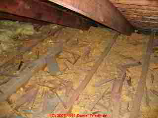 Dirty old attic insulation