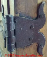 Reproduction of an antique-like hing on an armoire (C) InspectApedia.com Barbara