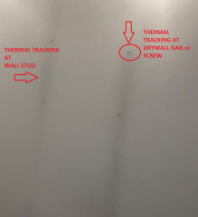 Thermal tracking ghosting spots on walls and ceilings show up as dark spots (C) InspectApedia.com
