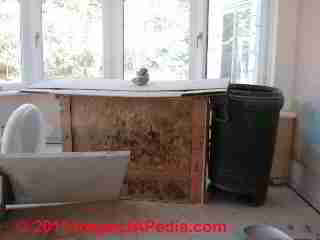 Hidden mold behind cabinets © D Friedman at InspectApedia.com 